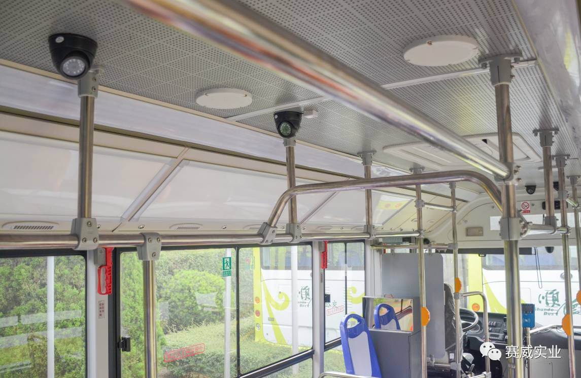 Modern Chinese bus interior with CCTV cameras